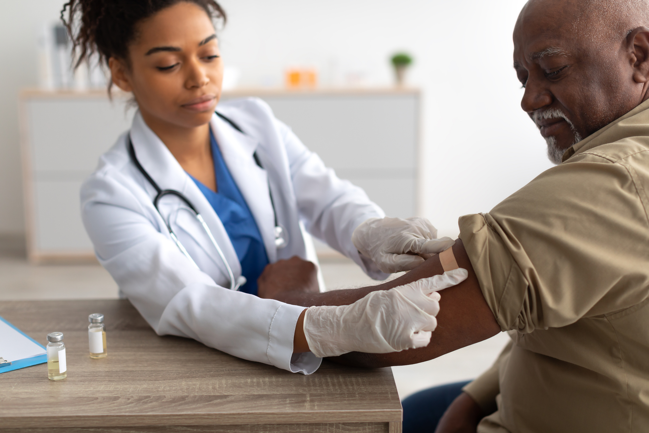 Man Getting Vaccinated, Doctor Applying Adhesive Bandage